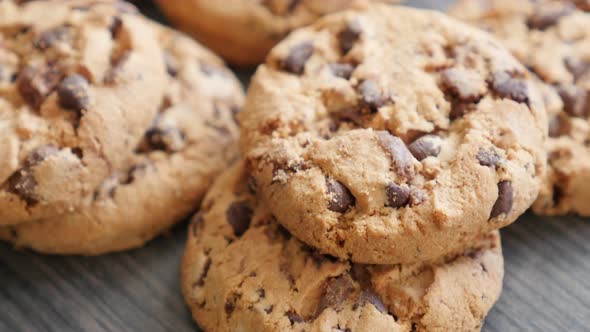 Chocolate chip cake biscuits on the table slow tilt 4K 2160p UltraHD footage - Slow tilting over cho alt