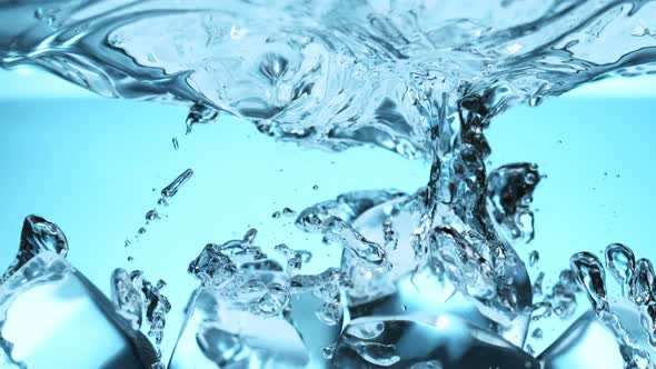 Super Slow Motion Shot of Clear Ice Cubes Falling Into Water at 1000Fps alt
