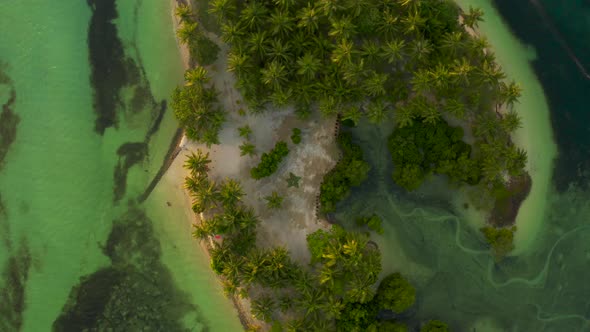 Side View of Romantic Young Couple Embracing on Beach Top Aerial View alt