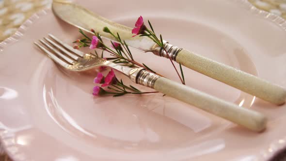 Various cutlery on wooden table 4k alt