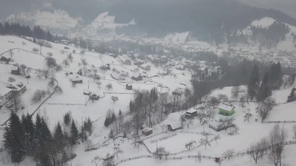 village Kryvorivnia covered with snow in the Carpathians mountains alt