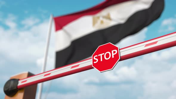 Opening Boom Barrier with Stop Sign Against the Egyptian Flag alt
