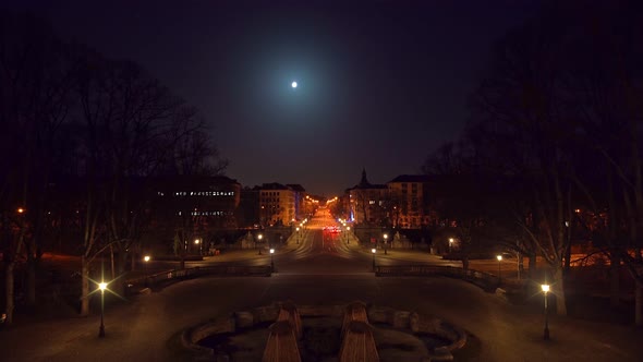 Timelapse of Munich at night, view from the Friedensengel Europaplatz at driving cars, stopping at r alt