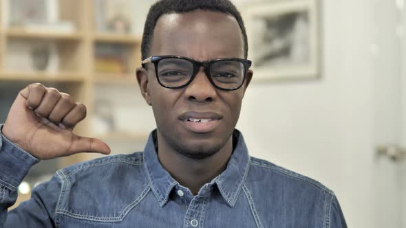 Thumbs Down by Afro-American Man alt