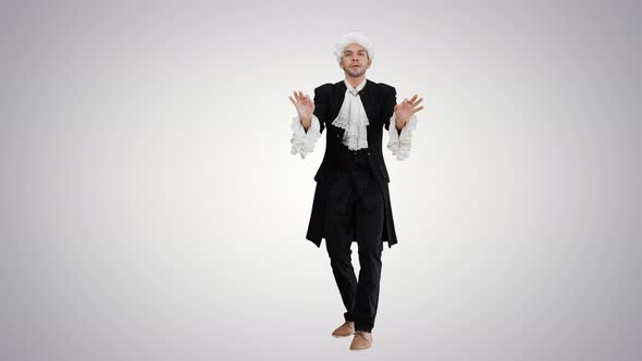Man Dressed Like Mozart Expressively Finishing Conducting While Looking at Camera on Gradient alt