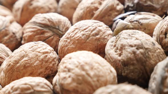 Walnuts  arranged on the table slow paning  4K 2160p 30fps UltraHD video - Raw food background of wa
