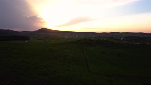 Aerial view of sunset over a hill, Transylvania, Romania alt