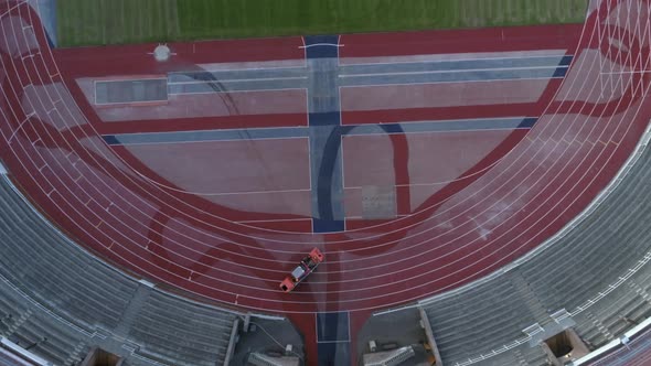 Aerial View of Machine Cleaning Athletics Stadium
