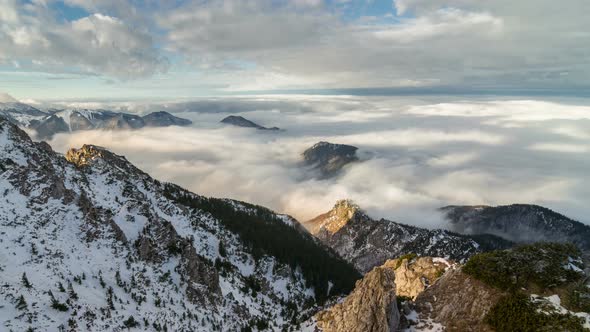 Foggy Morning above Clouds Flows in Winter Snowy Mountains alt