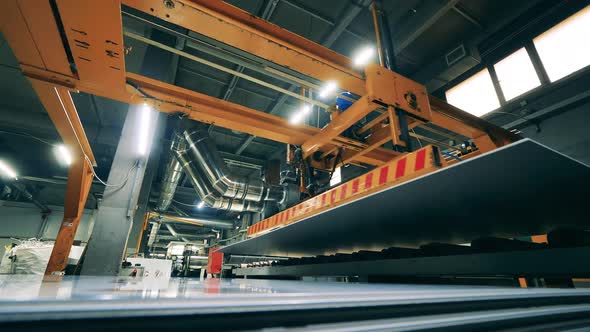 Metal Panels are Getting Mechanically Relocated in a Side View alt