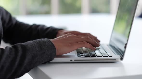 Businessman Working on Computer Laptop on Table in Office