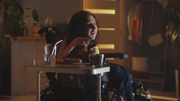 Woman with a Disability Using Gamepad alt