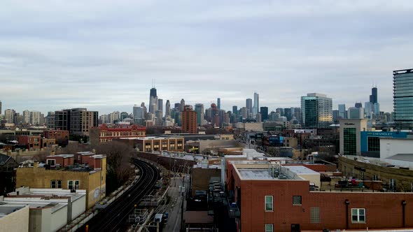 Chicago, Illinois City Buildings Skyline with Train Tracks Aerial Flight alt