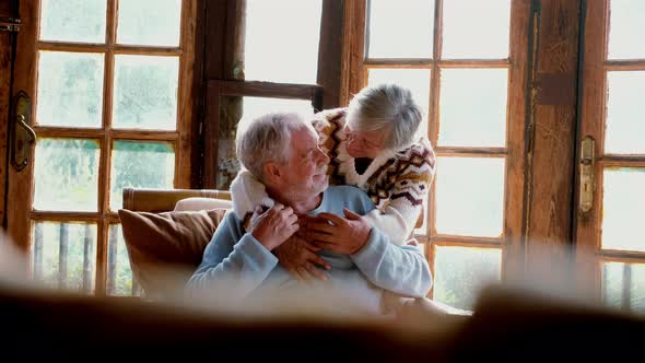 Senior people at home in love kissing and caring each other. Happy relationship mature man alt
