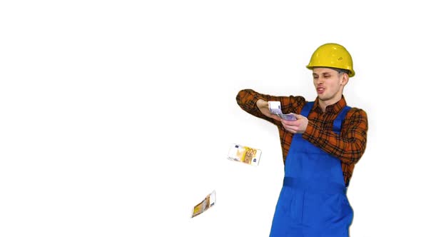 Costruction Worker in Yellow Hard Hat Throwing Money in the Air on White Background. alt