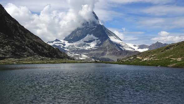 Time-lapse view on snowy Matterhorn peak and lake Stellisee, Swiss Alps, Zermatt,
