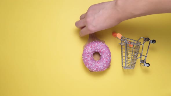 Donuts with Pink on a Yellow Background alt