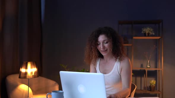 Beautiful Adult Lady Works Late in Her Home Office alt