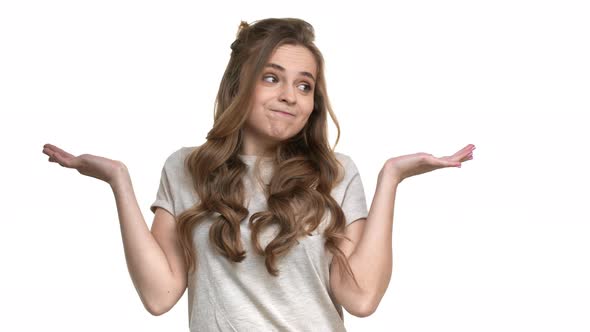 Portrait of Charming Woman Throwing Up Hands in Rejection Meaning Do Not Know Cannot Help or Have No alt