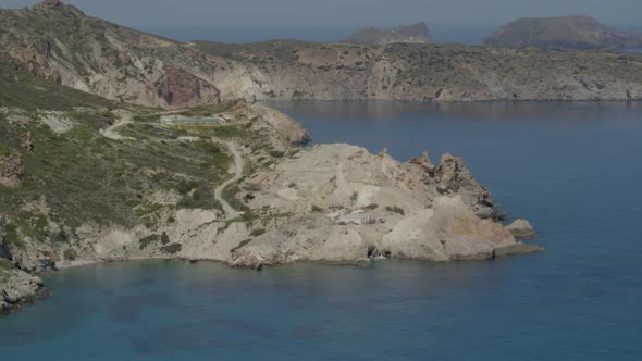 Aerial View of Cliffs Cascading into the Aegean Sea in the Island of Milos alt
