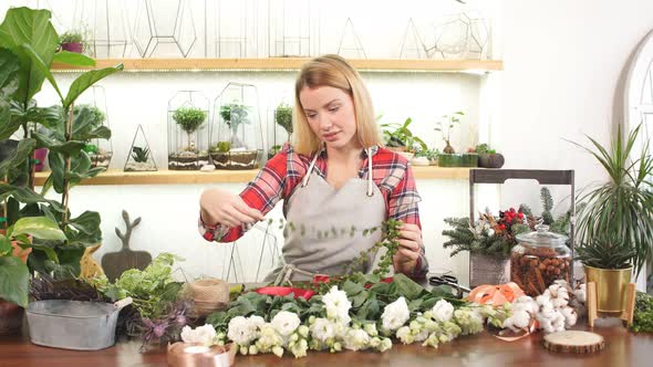 Pretty Young Blond Female Making Fashion Modern Bouquet of Different Flowers alt