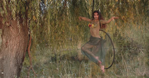 Gymnastics Performance By a Young Woman in a Spinning Hoop Dryad Body Art alt