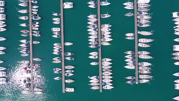 Bird eye view from drone of yachts and sailboats in the harbor marina. alt