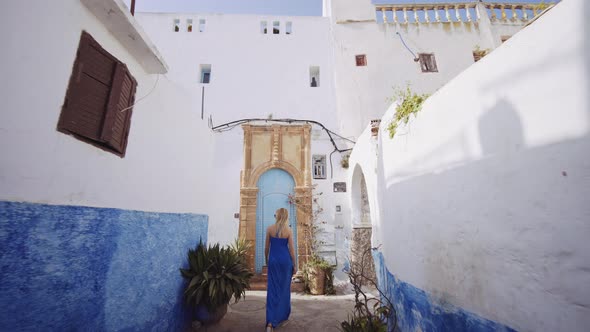 Blond Woman In Blue Dress In Kasbah Of The Udayas alt
