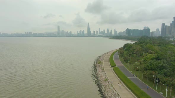 Shenzhen City at Day. Nanshan District Urban Skyline and Bay Park. China. Aerial Shot alt