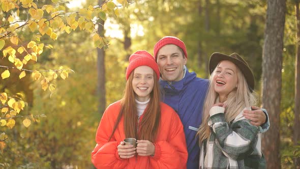 Camping Tent Camp in Nature Happy Caucasian Friends in Autumn at Nature Forest Hike alt