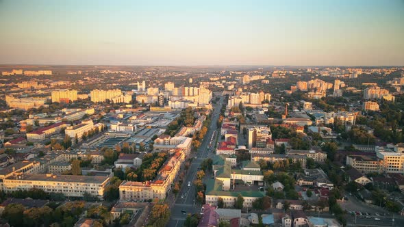Aerial drone view of Chisinau downtown at sunset. Panorama view of multiple buildings, roads with mo alt