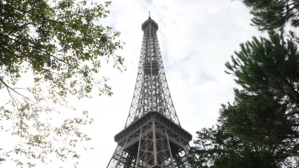 Slow tilt on famous symbol of France and Paris Eiffel tower 4K 2160p UltraHD footage - Beautiful Tou alt