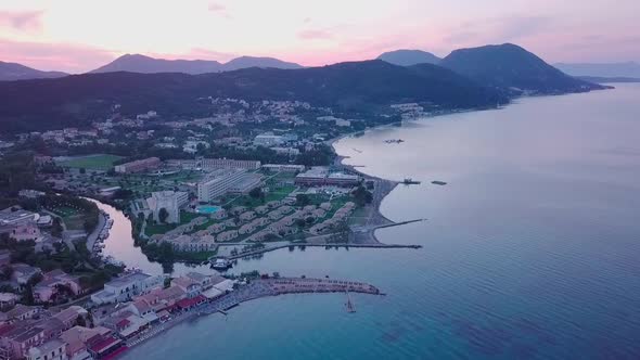 Greece, Corfu Island, drone footage of a sunset over Messonghi Beach. Flying Forward. alt