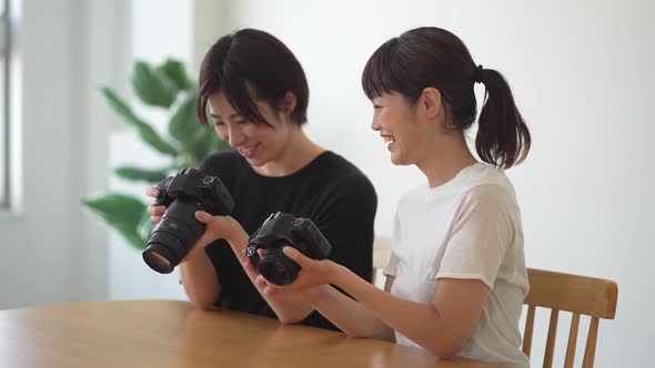 A woman looking at a photographed image alt