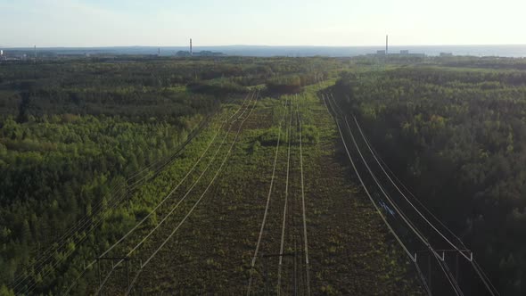 Smoking Cooling Towers at Nuclear Power Plant and Powerlines in Forest alt
