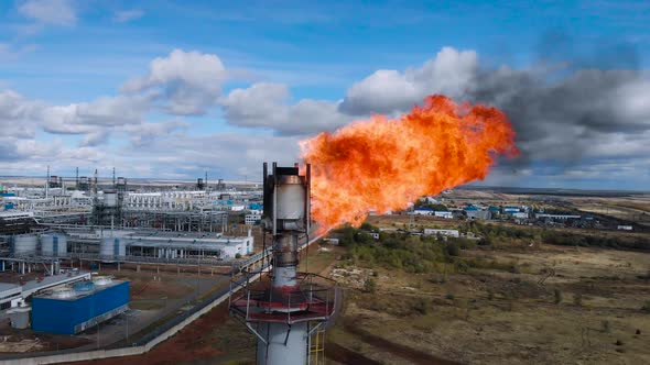 The Pipe at the Chemical Plant Burns the Residues of Natural Gas alt