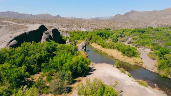Aerial View Bushes and Dry Grass in the Mountainous Terrain of the Utah Desert alt