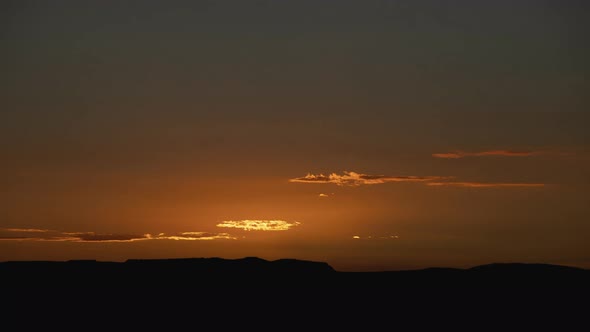 Golden Sunrise Behind Thin Layer of Clouds Timelapse Wide Shot