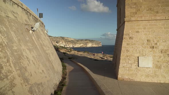 Stone Tower and Road Leading to Blue Grotto During Golden Hour Evening in Malta