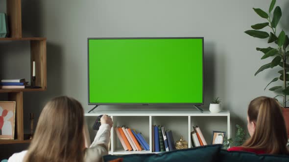 Women Watching Television with Chroma Green Screen alt