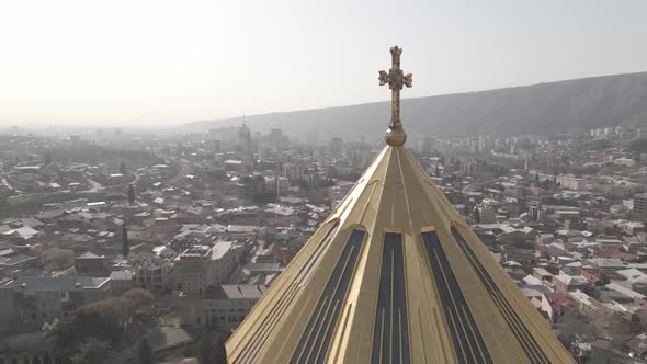 Aerial view of Holy Trinity Cathedral Sameba in Tbilisi Georgia. Sunrise drone footage 2021 alt
