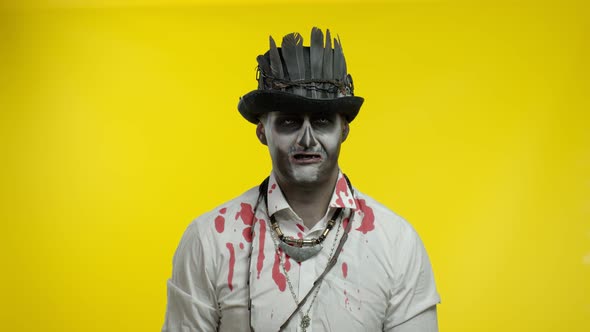 Creepy Man with Horrible Halloween Skeleton Makeup Looking Disappointed, Upset, Sad and Crying alt