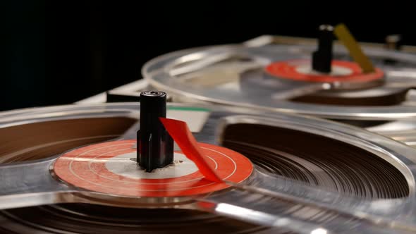 Vintage Reel to Reel tape recorder playing music close up of reel alt