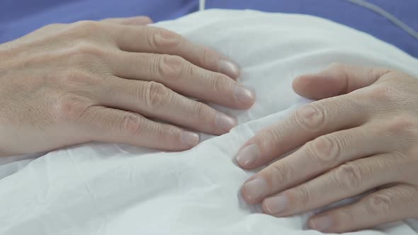 Hands of Elderly Man Lying on Stomach, Senior Male Sleeping, Having Rest in Bed alt