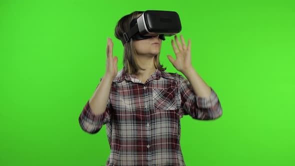 Young Woman Using VR Headset Helmet To Play Game. Watching Virtual Reality 3d 360 Video. Chroma Key alt