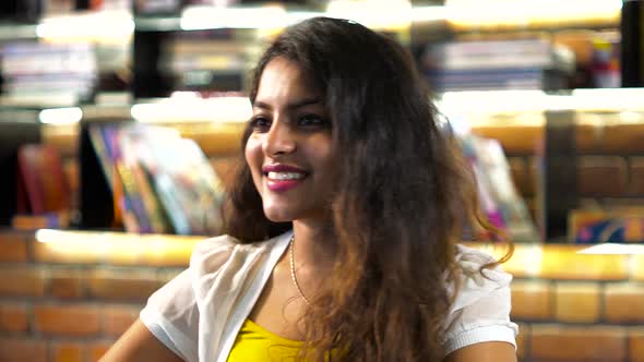 Adult hot girl in the cafe. Girl giving different expressions and taking with other person alt