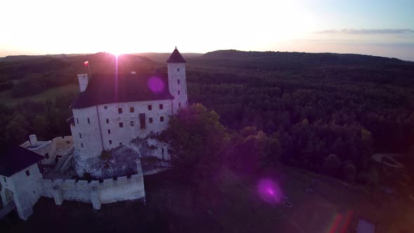 Castle in the forest, sunset, view from a drone