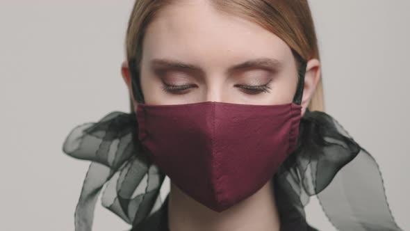 Close Up of Female Model in Stylish Face Mask alt