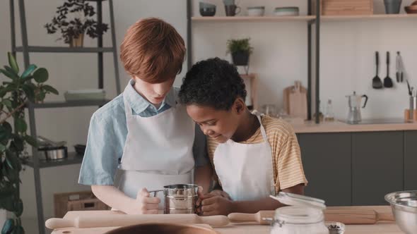 Boys Playing with Flour Sifter alt