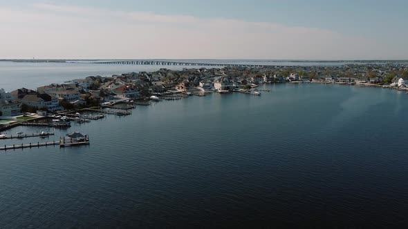 Aerial Shot of Neighborhood, Suburb. Flying Over the Pier with Boats Real Estate, Connecticut River alt